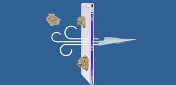 An illustration of particles being blocked as air flows through a furnace filter.
