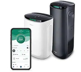 Two smart room air purifiers, one for a large room, one for a small room, and a smartphone with the Filtrete™ Smart App displayed in a diagonal row.