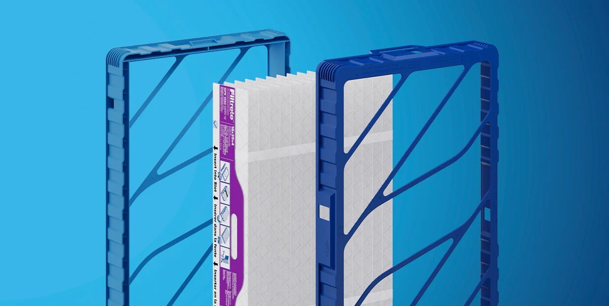 Three rectangular air‑filter components standing upright against a blue background.
