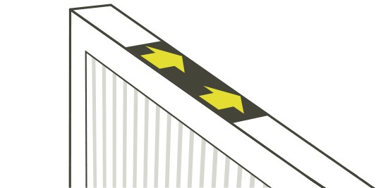 Une illustration d’un filtre à air avec des flèches indiquant la direction du flux d’air.
